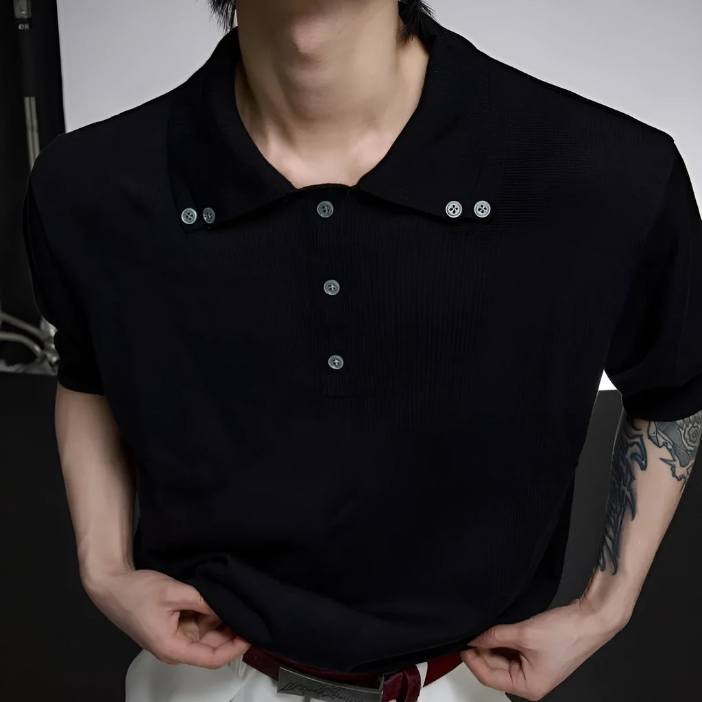 Man wearing a grey loose fit short sleeve shirt with a double collar lapel design.