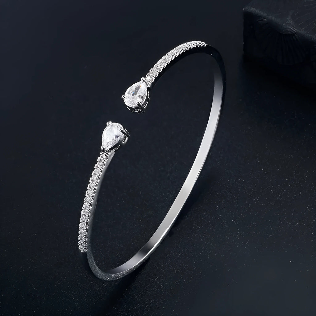 Copper personalised bracelet with multi-zircon inlaid design in simple style, shown in blue and white colour options.