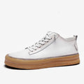 Men's black leather casual shoes with white stitching and lace closure on a white rubber sole
