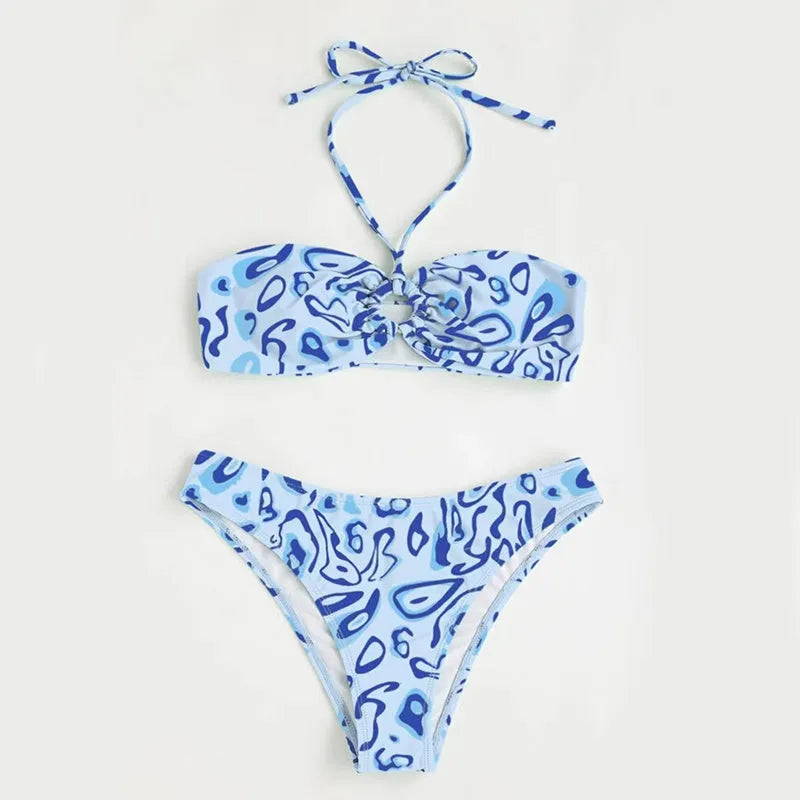 Green floral bandeau bikini swimsuit with split design on a mannequin