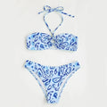 Green floral bandeau bikini swimsuit with split design on a mannequin