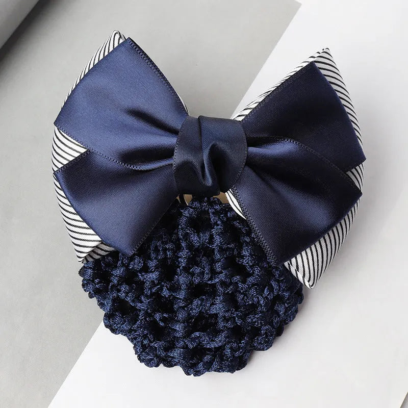 Professional flower bow headdress hair clip ornament on a work plate, shown in a selection of net and mesh colour variations.