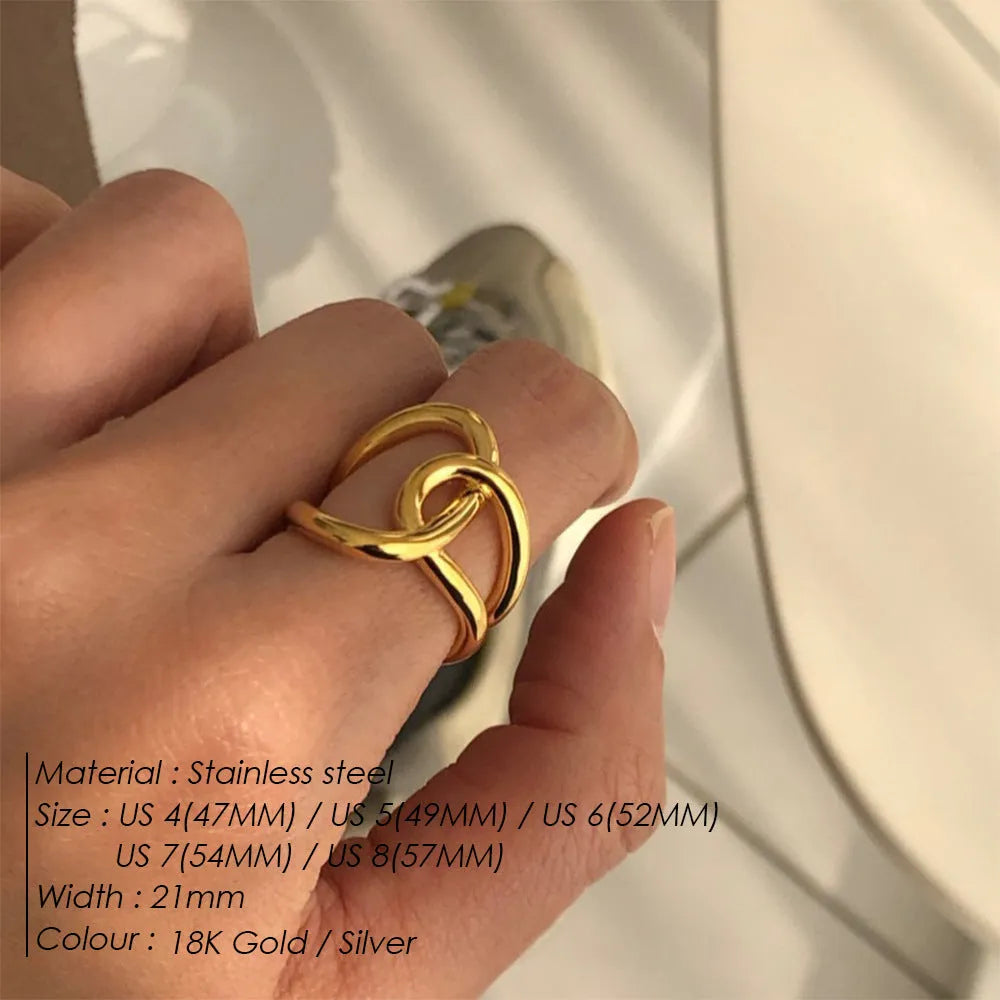Geometric knot ring with U-shaped profile in stainless steel with adjustable opening mechanism