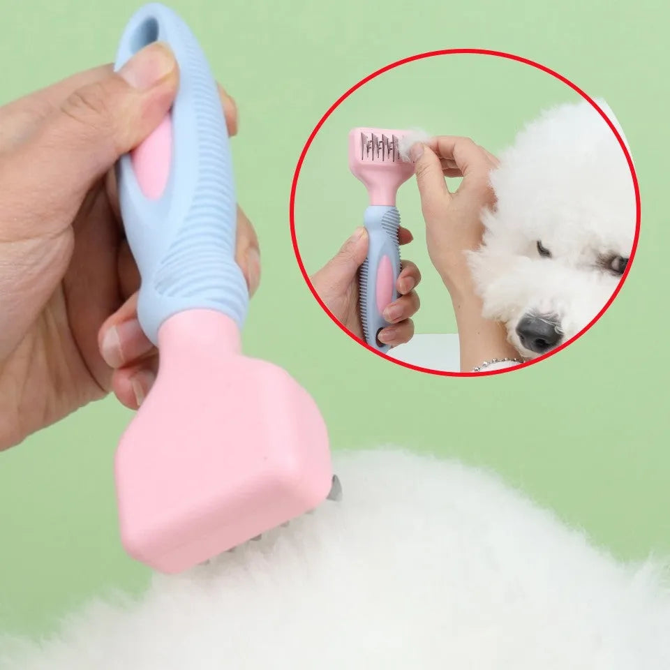 Pink stainless steel pet comb with comb teeth and an integrated knot-cutting knife blade.