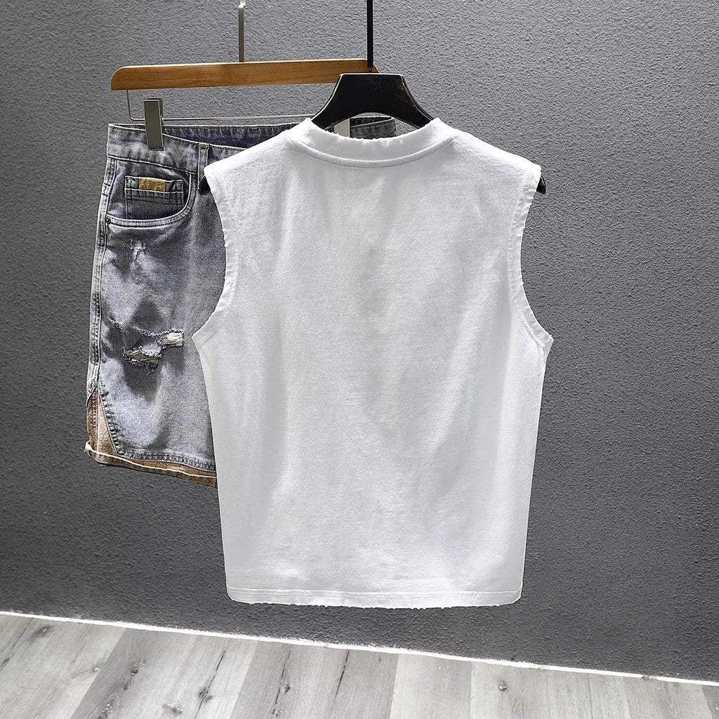A black loose-fit cotton sleeveless t-shirt with a straight hem, laid flat.