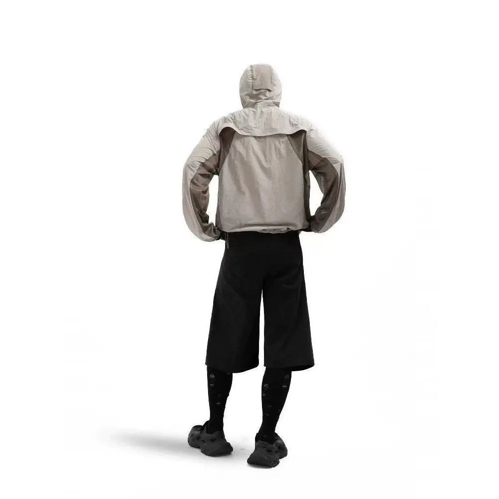 Mesh stitching sun protective nylon top in desert brown, showing regular length and construction.