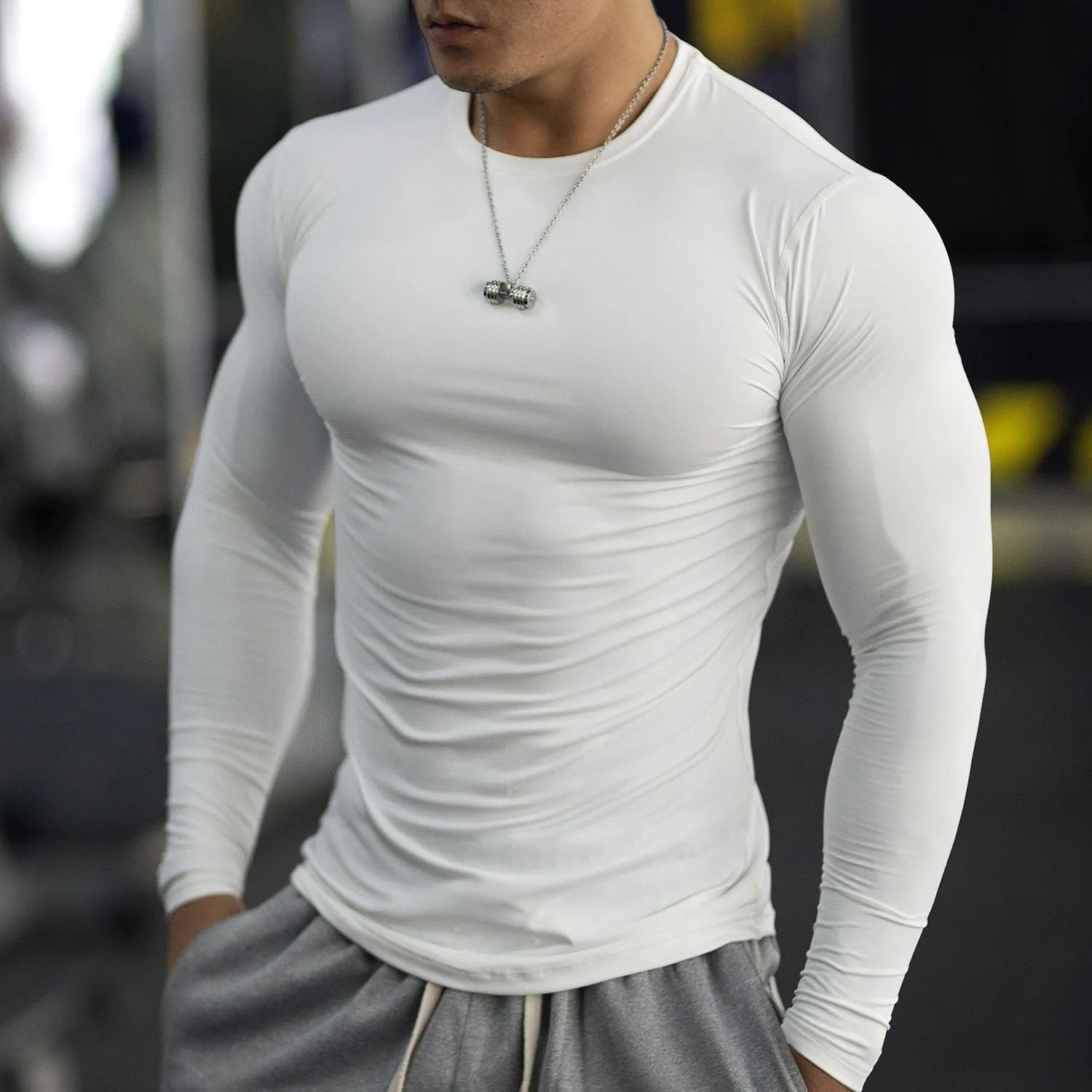Men's black slim-fit long sleeve fitness tights for running and gym workouts