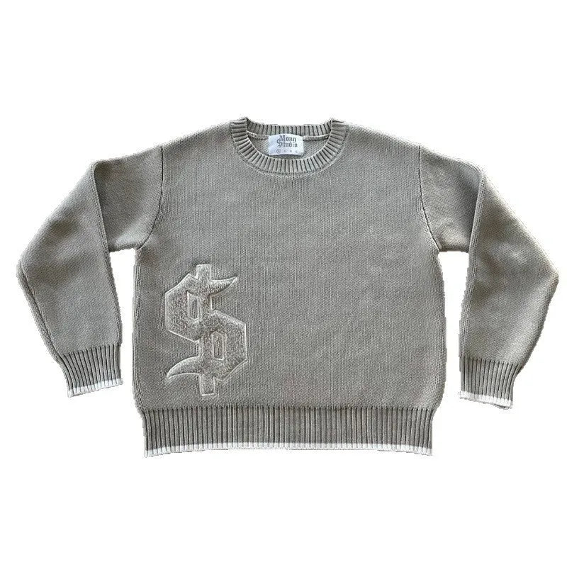 Grey loose-fitting jacquard knit pullover coat with long sleeves on a hanger.