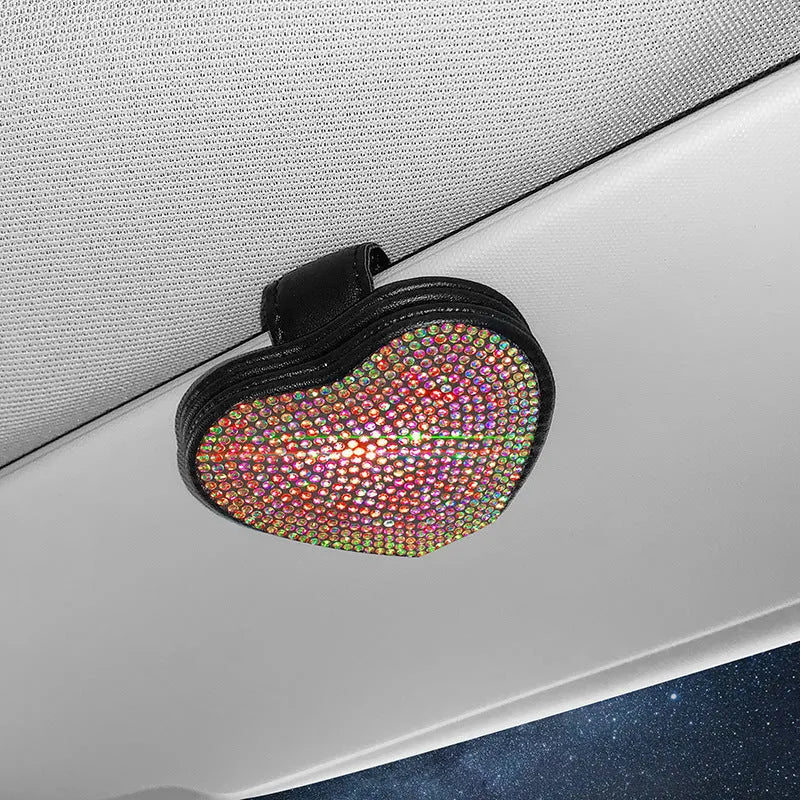 Black diamond-encrusted PU leather magnetic storage clip for car sun visor, holding sunglasses.