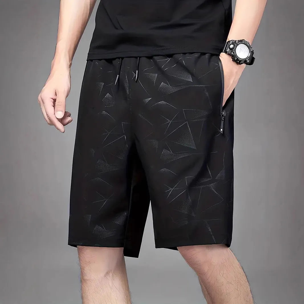 Men's black loose-fit polyester sports shorts with an elasticated waistband.