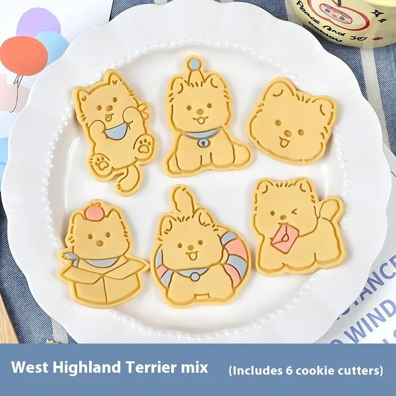 Three dimensional plastic biscuit mold showing puppy head and birthday hat designs
