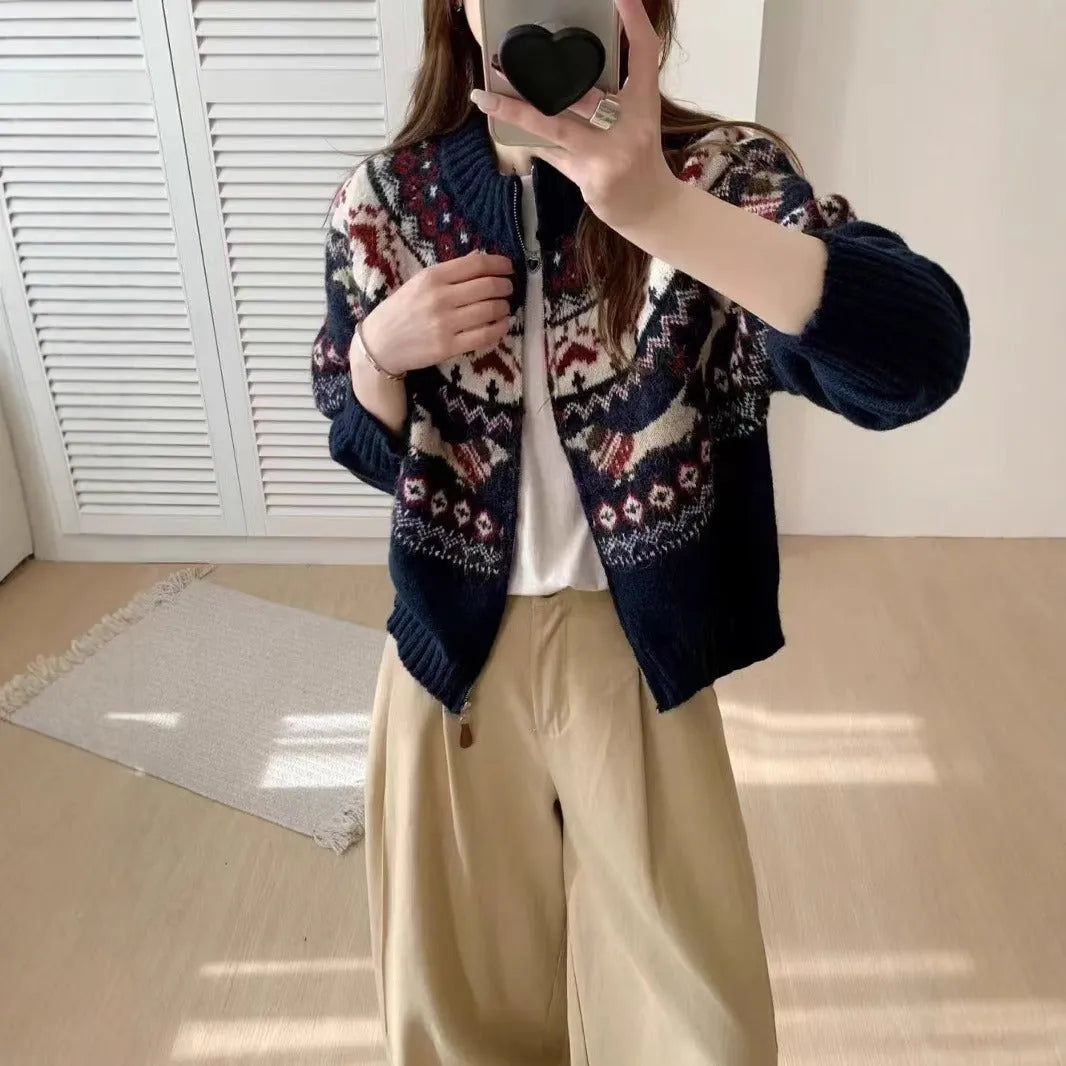 Women's ethnic jacquard pullover sweater with 3D pattern in beige apricot, showing loose fit and long sleeves.