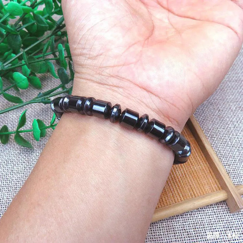Black pentagram stone magnetic therapy bracelet with stretch fit on wrist