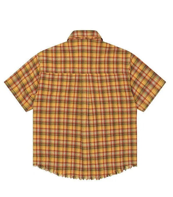 Yellow plaid loose fit short sleeve shirt with embroidered detail on the chest pocket.