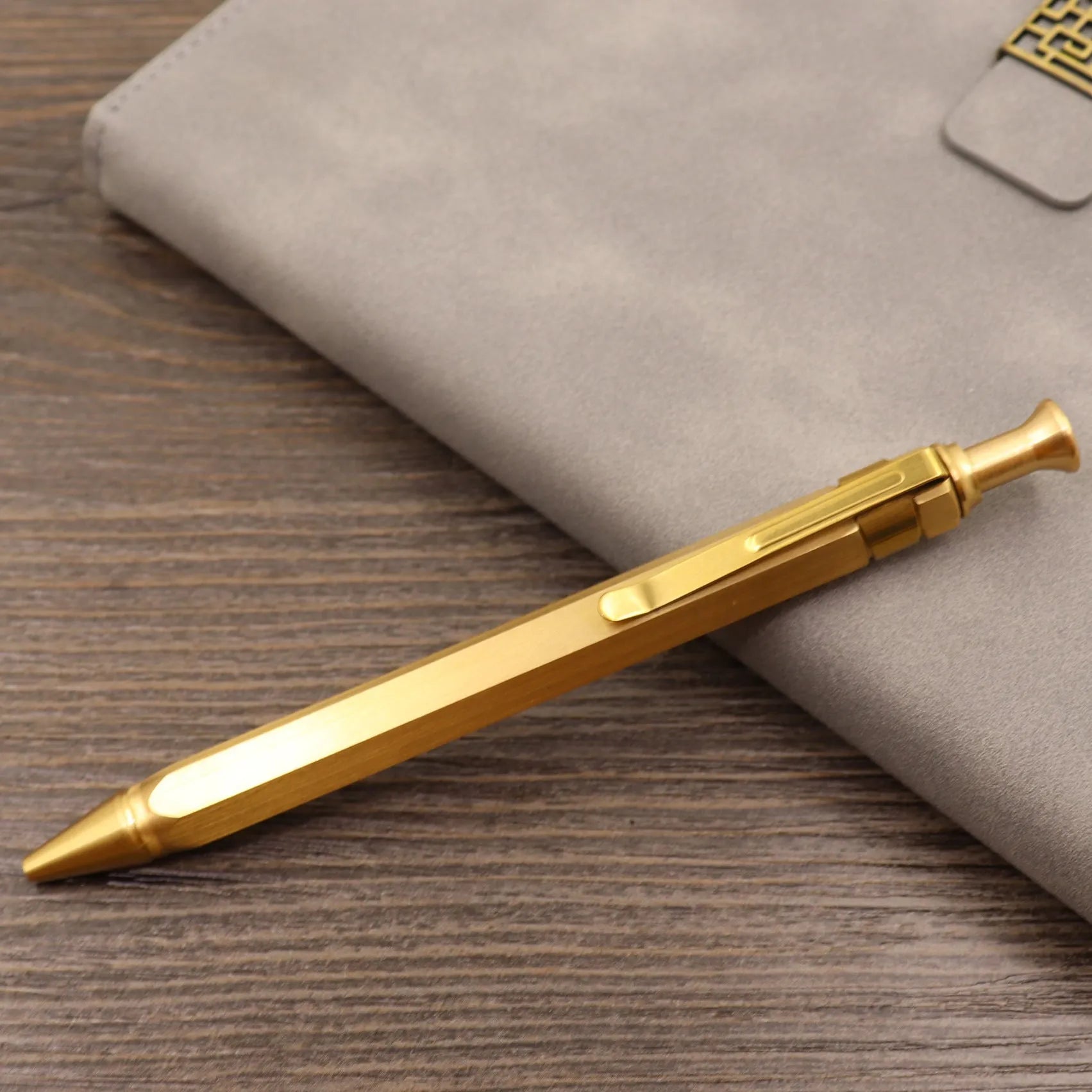 Retro brass tactical pen with bolt action mechanism in brushed natural finish