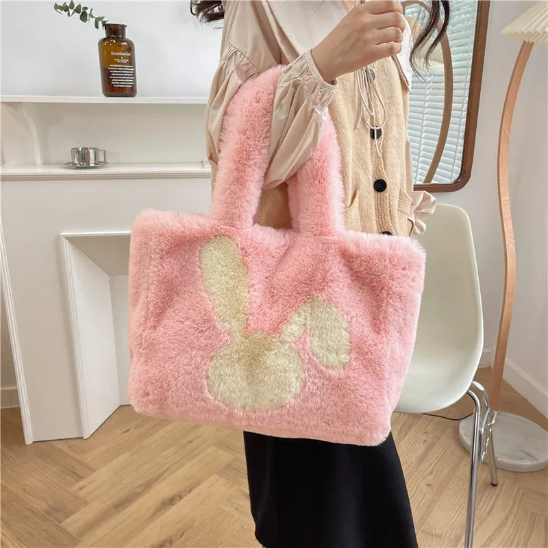 Plush shoulder bag with cartoon rabbit ears detail in solid colour