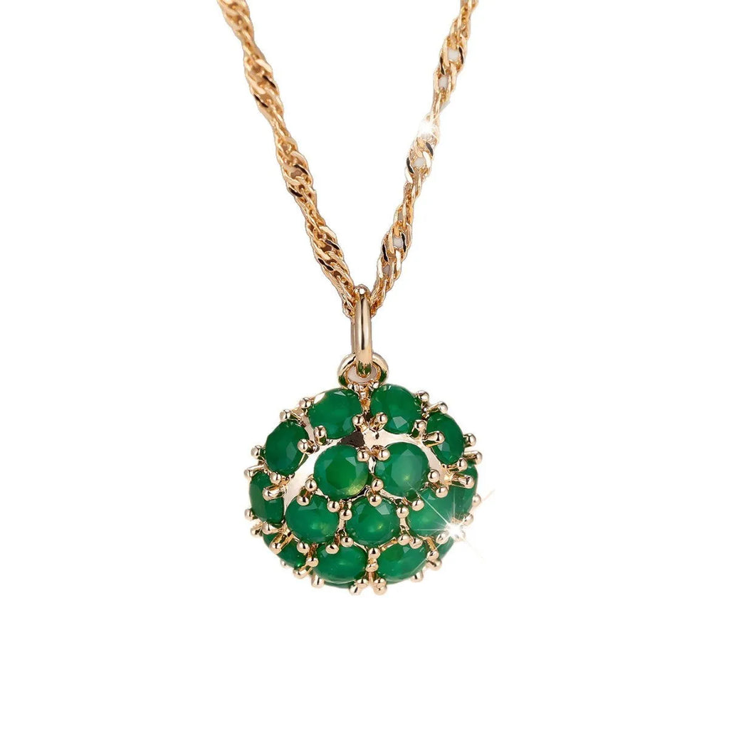 Round emerald pendant necklace with full diamond detailing in champagne gold colour on chain