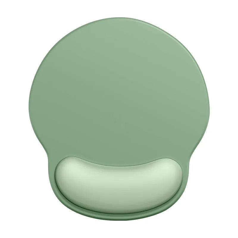 Silicone mouse mat with attached gel wrist support in a gradient blue colour on a desk.