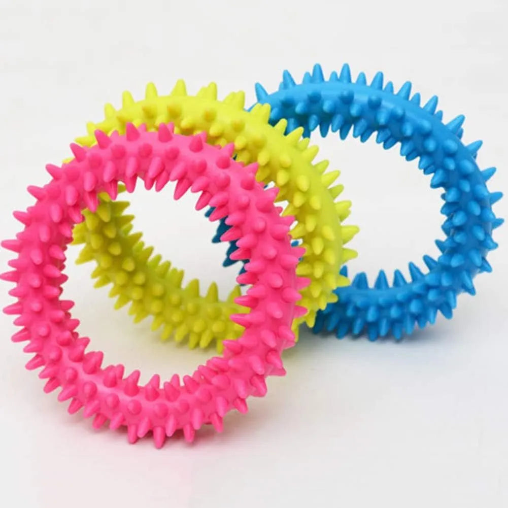 TPR spiky circle ring dog chew toy in assorted colours showing dental cleaning nubs