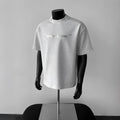 Men's white cotton short sleeve pullover shirt with regular sleeves on hanger