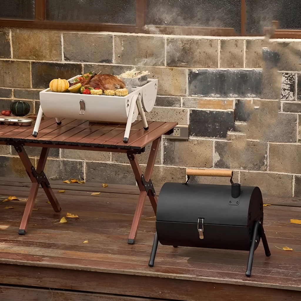 White round portable charcoal grill with detachable components for frying and baking