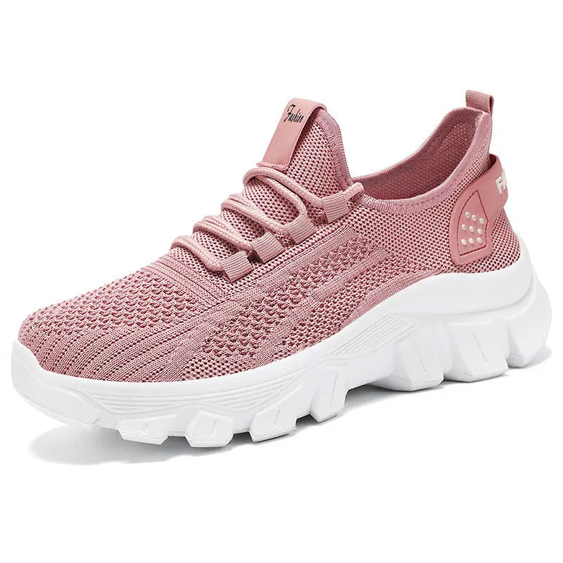 Men's white Flyknit lace-up running sneakers with a thick PVC sole on a plain background.