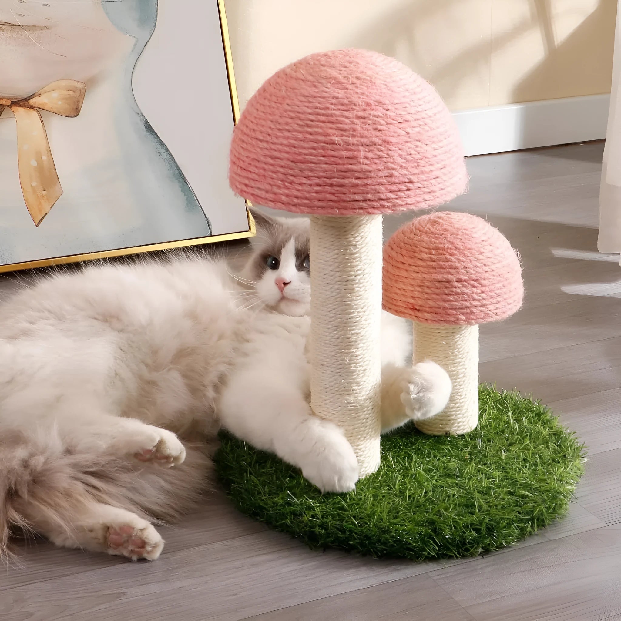 Pink mushroom-shaped cat scratching post made from natural sisal fibre with sturdy base for small cats