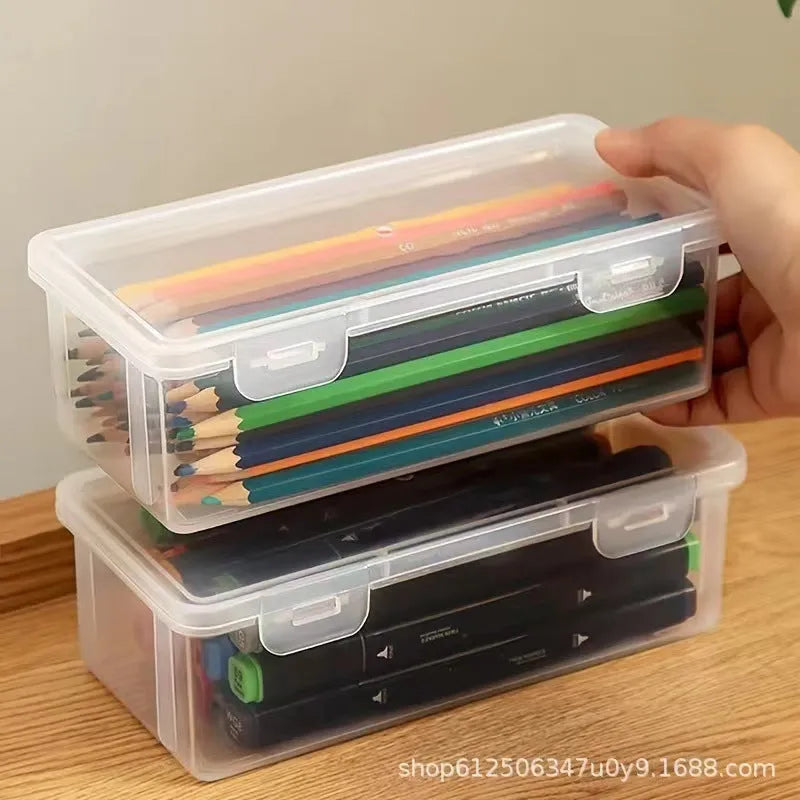 Large clear plastic stationery storage box filled with coloured pencils and wax crayons