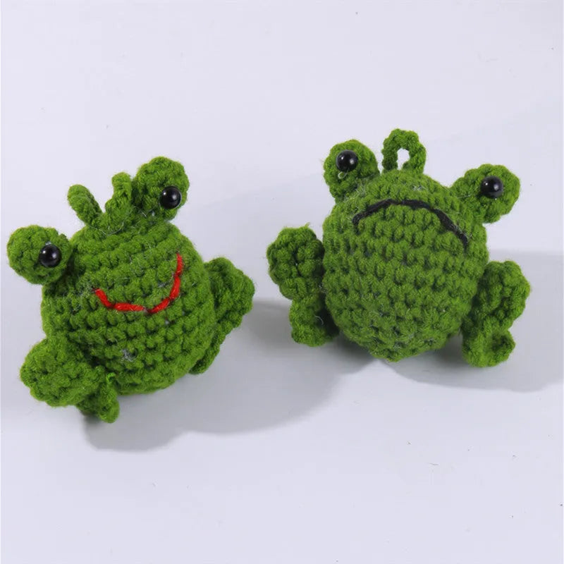 Handmade woven car pendant with a green frog plush doll hanging.