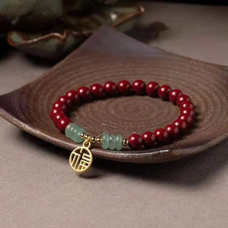Handmade wave-shaped bracelet with alternating cinnabar and copper beads.
