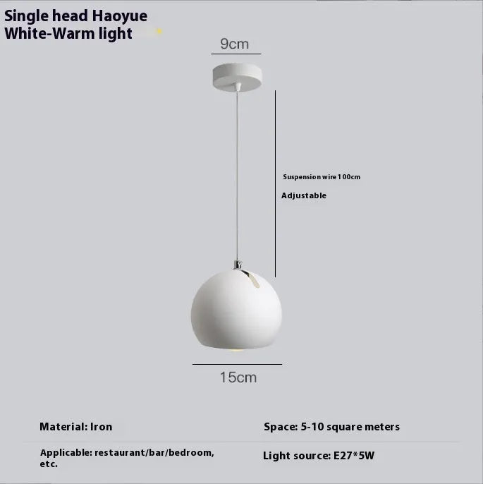 Modern Nordic-style ball chandelier table lamp in Moon White finish on a wooden surface.