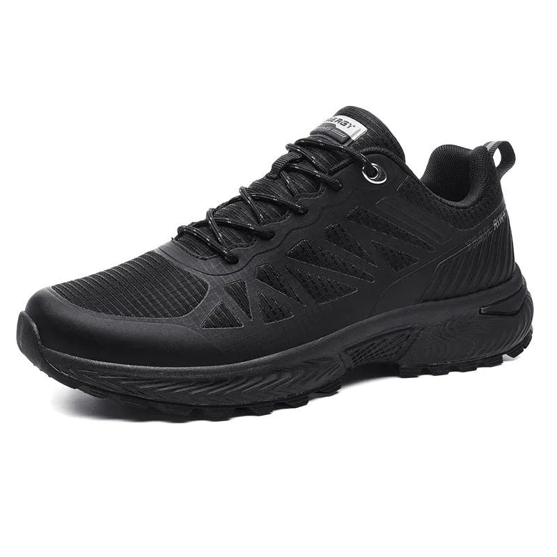 Men's black and orange mesh running shoe with lace-up front and rubber sole.