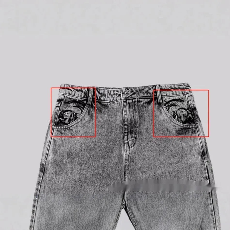 Grey loose fit straight-leg denim trousers with mid-waist design on a hanger