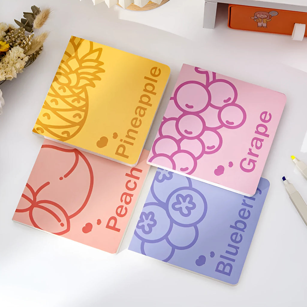 Square notebook with colour embossed fruit cover or white design, showing 14.5cm sides and 80g paper pages.