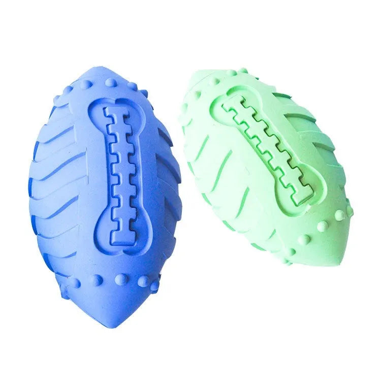 Light green rubber rugby ball dog toy with textured surface for teeth cleaning