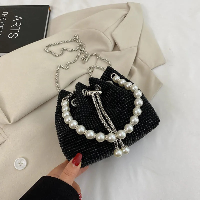 Black PU leather women's crossbody bag with diamond shoulder strap and chain detail