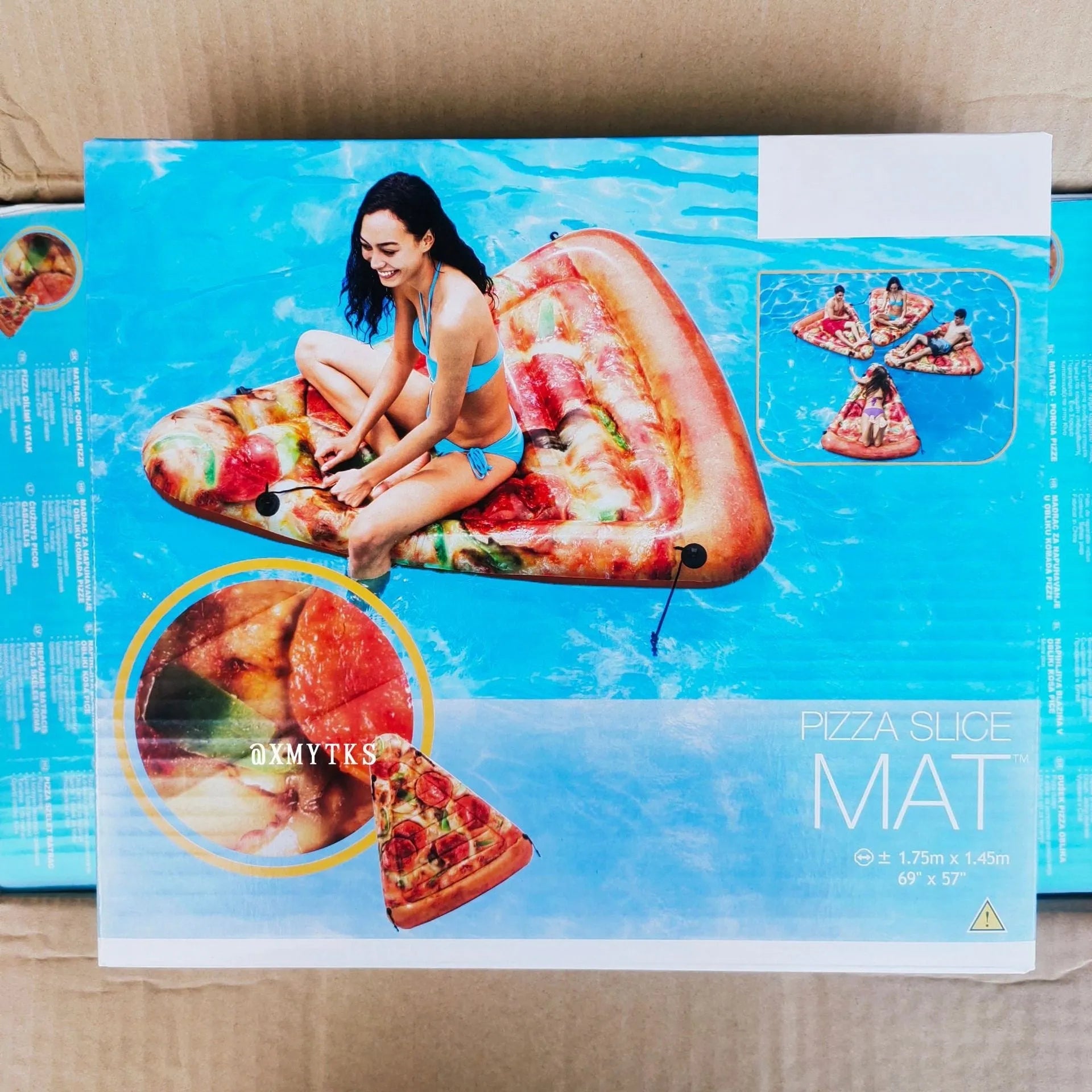 Large inflatable pizza slice pool float recliner on blue water