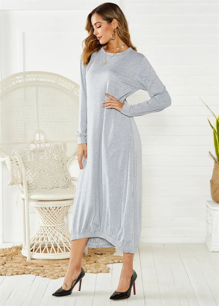 Loose black lantern dress with a lace-up crew neck, showcasing a relaxed silhouette.