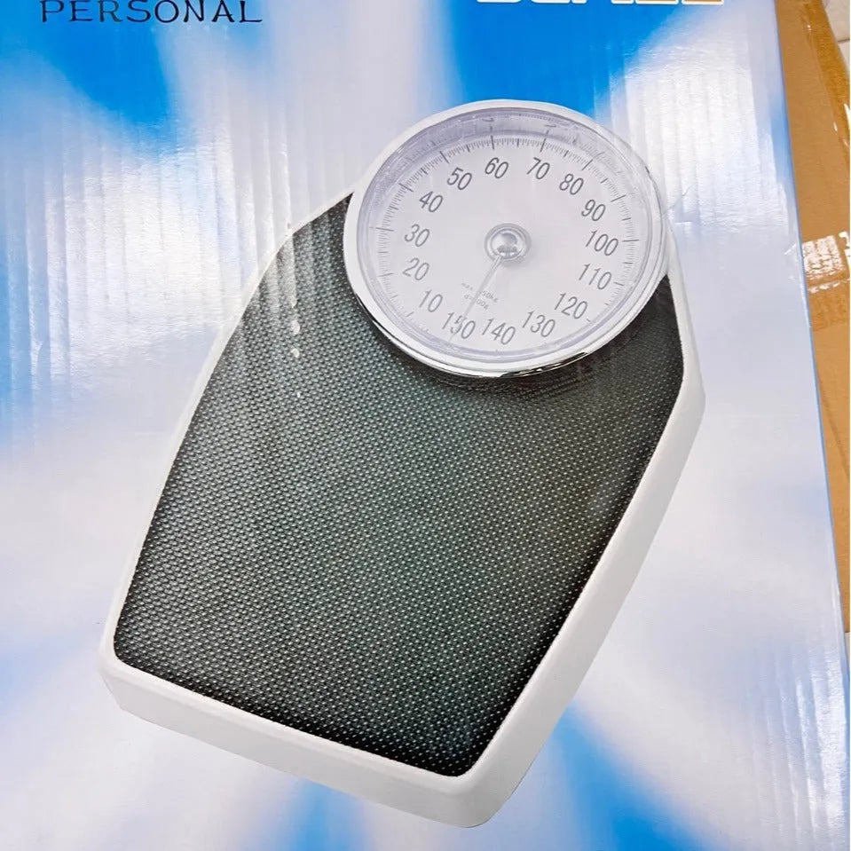 Black mechanical body weight scale with large dial measuring 47x35x11cm