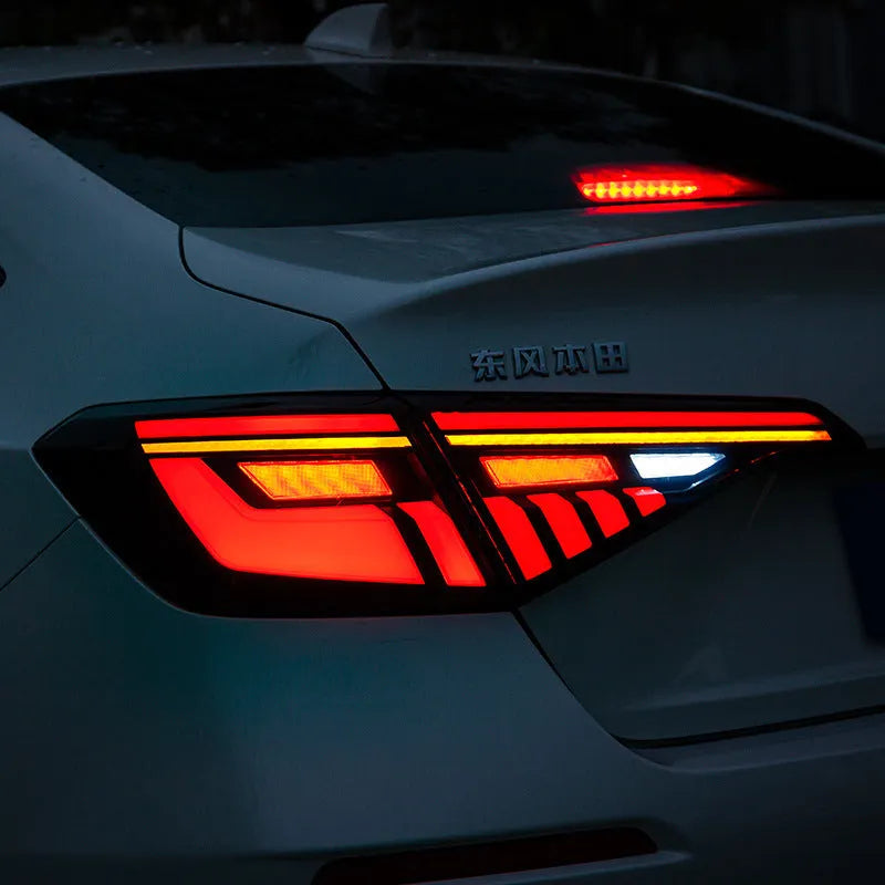 11th Generation Honda Civic black and red LED tail light assembly with sequential turn signal streamer.