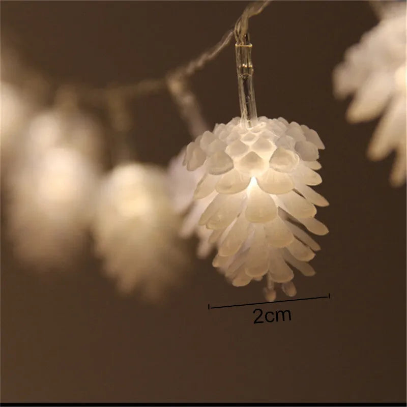 Warm white battery-powered LED pine cone decorative string lights shown in a 10-light or 20-light option.