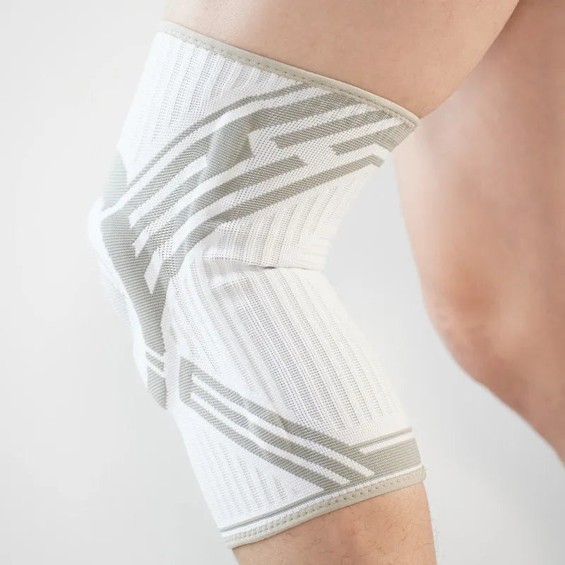 A blue cotton knee pad for adult sports like basketball and running, showing its elastic fit.