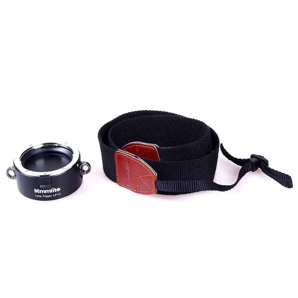 Aluminium alloy Nikon camera lens flipper dual holder with stainless steel buckle and cotton strap.