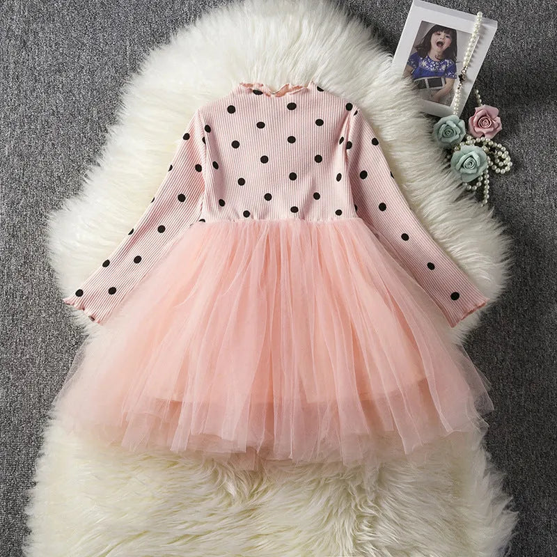 Baby girl wearing black lace tutu dress with long sleeves for birthday party
