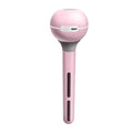 Pink and white Magic Wand portable USB humidifier with columnar design on a table.