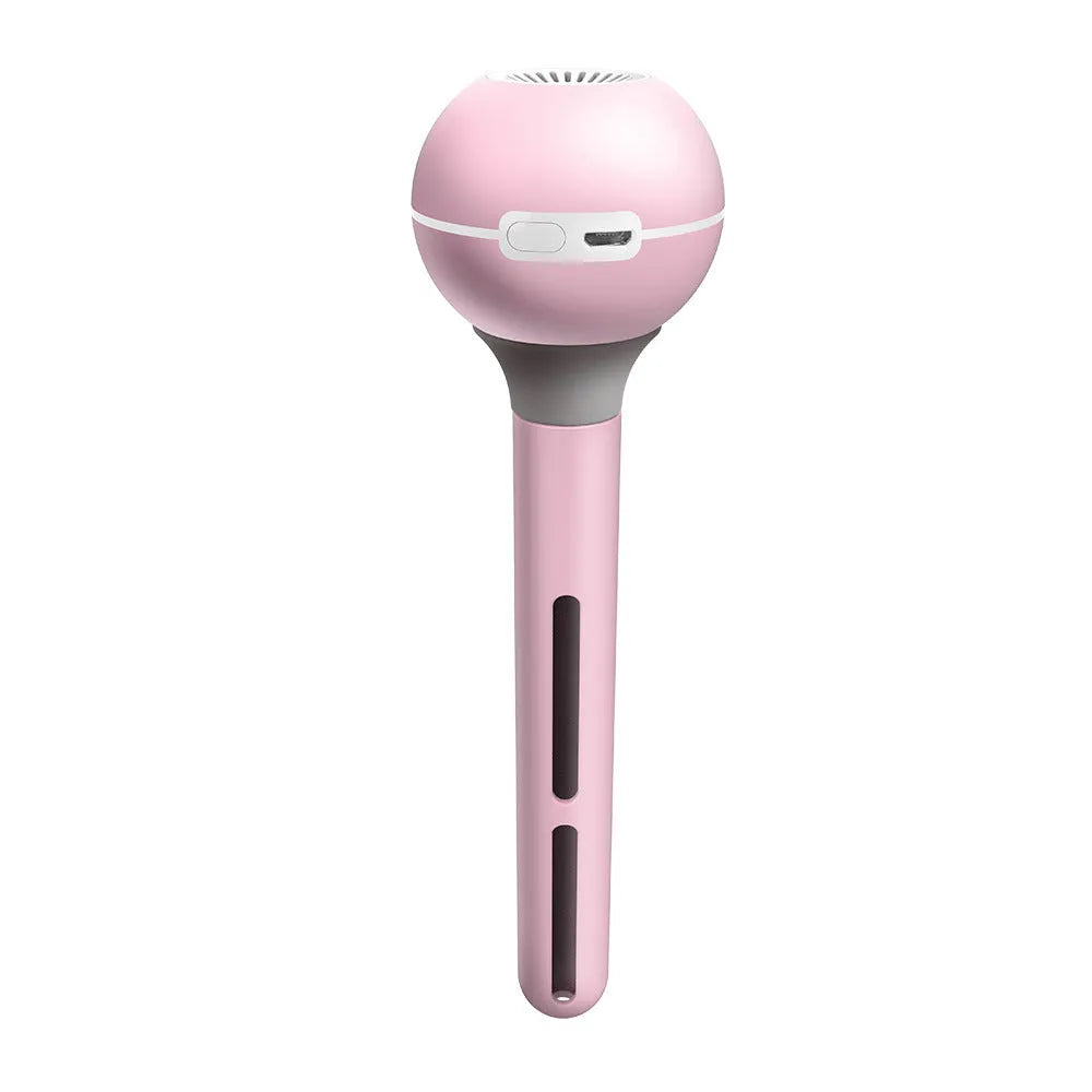 Pink and white Magic Wand portable USB humidifier with columnar design on a table.