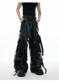 Black quilted leather pants with multiple pockets and loose-fit retro streetwear design