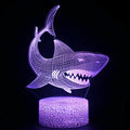 Shark-shaped 3D LED table lamp with colourful lighting on a black ABS base.