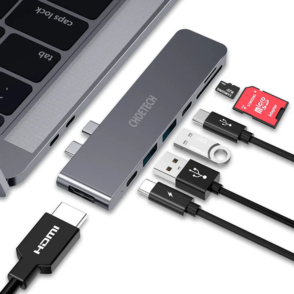 Silver aluminium USB-C 7-in-1 adapter hub with SD card slot, Micro SD slot, HDMI, USB 3.0, and USB-C ports