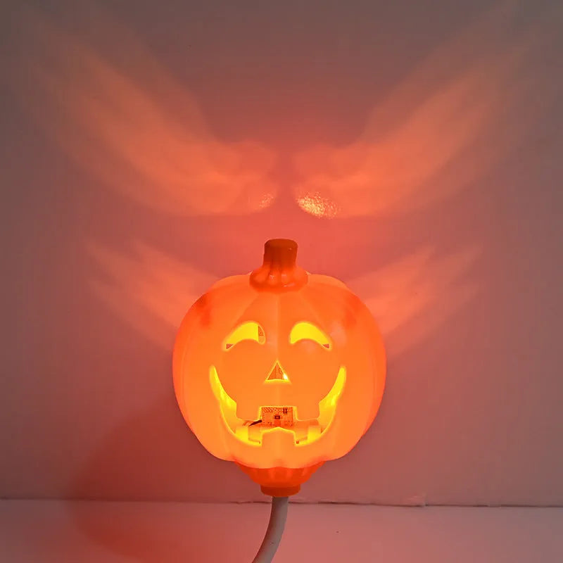 Plastic pumpkin-shaped decorative lamp with USB cable, showing purple or yellow light option.